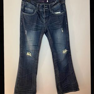 Vigoss dark blue distressed
vintage jeans. The new york flare size 7.